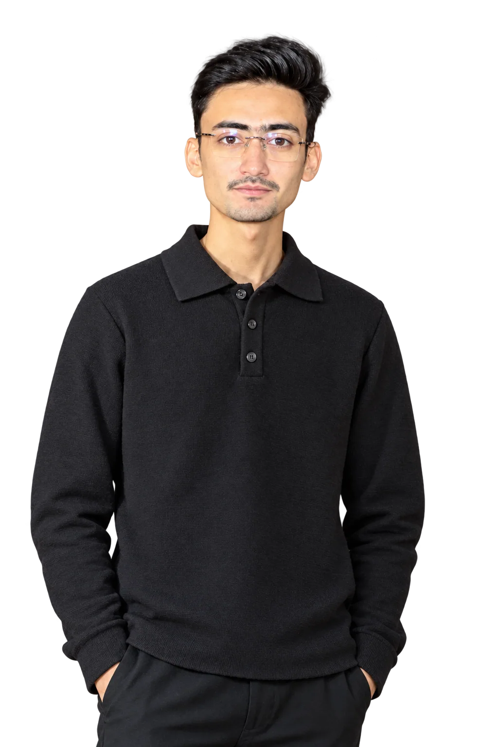 Gulfam Naqvi seated in a black polo